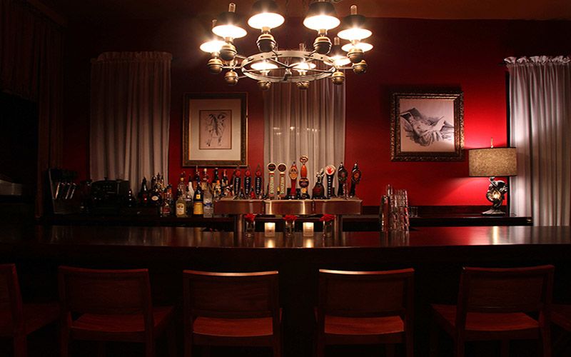 Baileys’ upstairs bar with chandelier